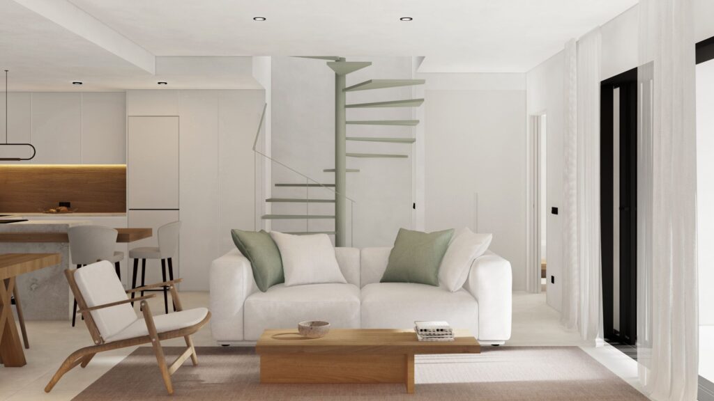 Salón de Casa Cotton con escalera de caracol en Nerja (Málaga) por Klic Arquitectos